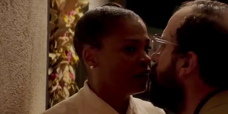 Cleo and Isaac in an awkward kiss during a scene in Lemon