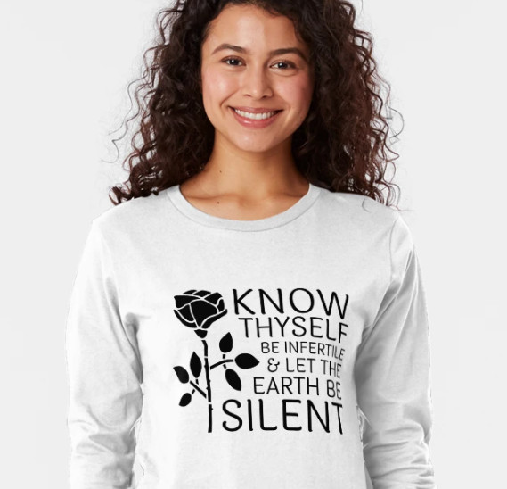 A smiling lady wearing a t shirt with a quote from Zapffe's Last Messiah